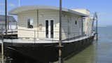 The Harbour Houseboat, which offers stunning views across Bembridge Harbour in Isle of Wight, has a commodious open-plan living space and kitchen—and warmly furnished rooms that boast plush Loaf beds.