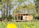 Surrounded by forest and meadows, this minimalist cabin in Lettele, Netherlands, is a prefab project by Dutch designers Arno Schuurs and Paulien van Noort. The smart and sustainable layout incorporates large windows that bring in the outdoors. Materials such as untreated Oregon pine planks, oak fishbone flooring, concrete, and raw steel were used to keep the construction footprint low.&nbsp;