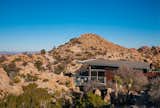 Set high in the desert of Yucca Valley, California, this pre-engineered steel cabin is part of an environmentally-conscious design system that was created by Blue Sky Building Systems and o2 Architecture.