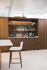 The kitchen and bar millwork is ApplePly with a walnut veneer.