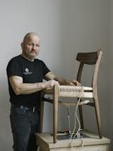 Master weaver Benny Hammer Larsen has  worked for Danish furniture company Carl Hansen  &amp; Søn for more than two decades. He travels the globe, demonstrating the meticulous techniques used to realize each piece. He stands next to the  reintroduced CH23 dining chair, by Hans J. Wegner.  Photo 2 of 12 in Warp Speed