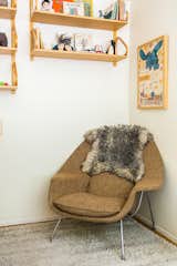 In daughter Elliot’s room, a vintage Womb chair by Eero Saarinen is situated below Alvar Aalto 112 shelving scored on eBay.