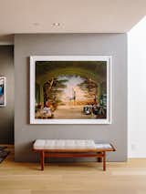 Living Room and Bench The Richard Barnes photo pops against a gray Venetian plaster wall.  Photo 8 of 9 in 10 Tips for Hanging Art in Your Home—and Our Picks for Creating Fearless Walls from Domino Effect: How a Bedroom Refresh Jump-Started a Whole-House Remodel For a Tech Exec