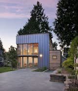 This Seattle ADU makes a modern statement that's clad in copper and cedar. The backyard "garden pavilion" connects to the main house by way of an expansive slate courtyard.&nbsp;