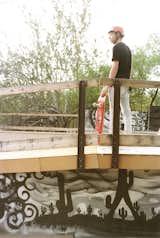 Addison stands on the deck of the bowl above graffiti art by  Lalo Cota.  Photo 13 of 15 in In Praise of Shadows