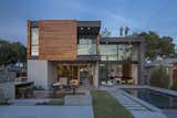 Exterior, House Building Type, Wood Siding Material, and Flat RoofLine Minarc’s GRASSsit bar stools, topped with synthetic turf recycled from football fields, sit near the  barbecue.  Photo 5 of 12 in A Southern Californian Prefab Is Paradise for the Whole Family