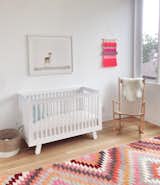 The resident’s daughter, Clara, has a Hudson crib by Babyletto, a vintage J16 rocker by Hans Wegner, and a vintage rug in her bedroom.