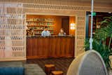 With its 15 floors, The Laylow stands above Kuhio Avenue in Honolulu’s Waikiki neighborhood on the South Shore of Oahu. The welcoming, tropical lobby is located on the second floor, providing a place for guests to enter peacefully away from the hustle and bustle of the street.