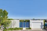 Outdoor, Trees, Shrubs, Front Yard, and Metal Fences, Wall  Photo 7 of 16 in Pierre by Benigeri from ‘Friends’ Star Matthew Perry’s Midcentury Stunner in the Hollywood Hills Is For Sale