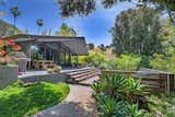 Outdoor, Horizontal, Wood, Large, Back Yard, Grass, Trees, Concrete, and Wood  Outdoor Grass Horizontal Wood Large Concrete Photos from John Legend and Chrissy Teigen's Former Midcentury Home in the Hollywood Hills Is For Sale