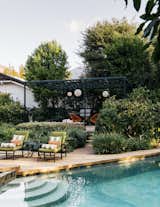 Outdoor, Swimming, Trees, Shrubs, Large, Small, Back Yard, Stone, and Hanging  Outdoor Hanging Shrubs Stone Back Yard Photos from A Laser-Cut Pergola Completes a Tranquil Garden in L.A. That’s Perfect For Entertaining