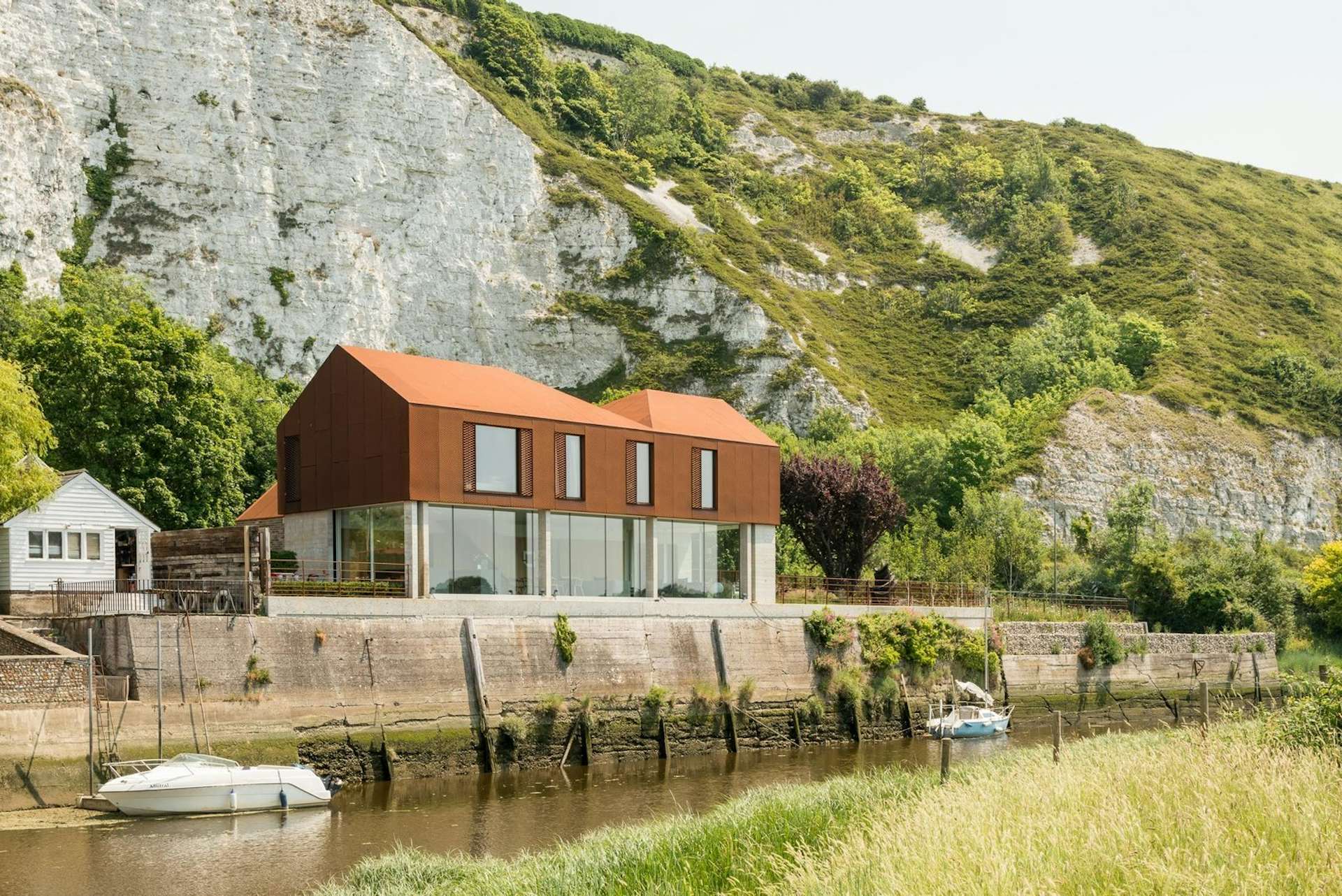 Though this 2,808-square-foot home in East Sussex, England, used to be an old workshop, Sandy Rendel Architects transformed it into a beautiful home. The building shell was made of SIPS (structured insulated panels) and was prefabricated off-site. 