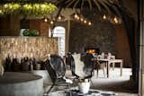Recycled glass was used for chandeliers and black and white cow hides were used to reflect the rural way of life in the villages.  Photo 7 of 11 in Take an Eco-Escape to a Spherical Forest Villa in an Eroded Volcanic Cone in Rwanda