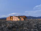 On a five-acre property outside Taos, New Mexico, designer Molly Bell worked closely with her father, builder Ed Bell, to create a new residence for owner Lois Rodin. “Lois requested that it appear as a grouping of individual masses, so that it read more like a cluster than a solitary shape,” Molly says. “I hope it shows that it’s OK to do something modern in such a traditional environment, and not to be afraid of it.”
-
Taos, New Mexico
Dwell Magazine : July / August 2017