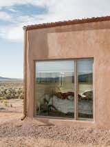 A gravel perimeter keeps mud from splashing on the walls when it rains. Adds Molly, “You can get away with minimal landscaping because there’s so much natural vegetation here.”
-
Taos, New Mexico
Dwell Magazine : July / August 2017