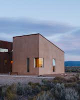 The house measures approximately 2,500 square feet. Molly, who was born and raised in Taos, says, “Proportionally, it’s a very human scale, and it salutes the unconventional architecture found in local Earthship houses and owner-built homes.”
-
Taos, New Mexico
Dwell Magazine : July / August 2017