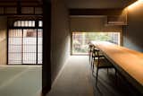 Dining Room, Table, Chair, Recessed Lighting, and Carpet Floor  Photo 10 of 13 in Nichinichi Townhouse by Dwell from A Minimalist Townhouse Provides Serene Accommodations in Historic Kyoto
