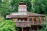Repurposed Ship Materials and 100-Year-Old Beams Make Up This Tree House-Like Home