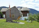 Available for rent through Urlaubsarchitektur, Ufogel’s exterior is covered in rustic Austrian-style shingles, but its sharp angles and asymmetrical shape gives it a distinctly futuristic, nest-like look.