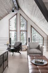 A dated A-frame cabin in Lake Tahoe is updated with a monochromatic palette. "The house had a generic look—lots of golden pine, chopped-up spaces, and laminate countertops," says designer Diana Vincent of High Camp Home about a 2,700-square-foot A-frame she recently renovated alongside MSM Construction. The team enlarged the kitchen and opened it to the living and dining areas, creating one large space. A dark, cramped staircase was replaced with a free-floating one. Reconfiguring the master bedroom and a bathroom yielded yet more precious usable space.