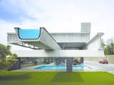Outdoor, Lap Pools, Tubs, Shower, Grass, Back Yard, Swimming Pools, Tubs, Shower, and Concrete Patio, Porch, Deck  Photos from 10 Works of Architecture That Reveal the Acrobatic Wonders of Concrete