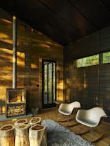 Zen-like in its simplicity, the weekend home of Michael Neiswander and Nick Corsello is an Eastern oasis tucked into the mountains of North Carolina.&nbsp; In each room, a single wall was clad in reclaimed poplar.