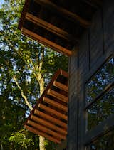 Windows The home’s board-and-batten siding is black-stained pine punctuated by Jeld-Wen windows.


Scaly Mountain, North Carolina
Dwell Magazine : September / October 2017  Photo 10 of 82 in outdoors from A Rustic-Modern Cabin Inspired by Japanese Bungalows and Shou Sugi Ban