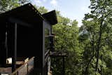 Exterior, House Building Type, and Wood Siding Material One of the pitched roofs shelters a side deck, which has a SwingLab bench.


Scaly Mountain, North Carolina
Dwell Magazine : September / October 2017  Photo 8 of 12 in A Rustic-Modern Cabin Inspired by Japanese Bungalows and Shou Sugi Ban