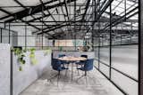 Office, Study Room Type, Chair, Storage, Rug Floor, and Concrete Floor  Photo 4 of 14 in An Art Deco Warehouse in Melbourne Is Converted Into a Shared Office Space