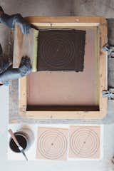 Patterning:  Using a method inspired by the cuerda seca technique,  hand-painted tiles are screen-printed with a dry line formula made with oil or wax to keep glazes separate during ﬁring.  Photo 11 of 13 in Go Behind the Scenes at Fireclay Tile’s Factory