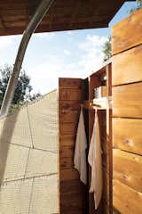 The open-air shower features a screen Moore wove from marine rope.&nbsp;