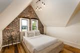 Bedroom, Bed, Pendant Lighting, and Dark Hardwood Floor  Photo 11 of 14 in Modern Interiors Shine Behind the 19th-Century Facade of This Nashville Home, Now Asking $2.1M