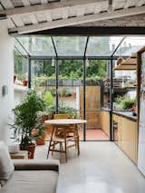It was cramped and dark when Hernán Landolfo and his girlfriend bought this Buenos Aires apartment, but after Landolfo reconfigured it as open-plan space with a greenhouse-like folding glass wall that unites the indoors and outdoors, it now feels airy and spacious.&nbsp;