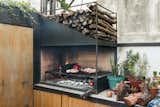 A sleek version of the traditional  parrilla, or grill, handcrafted  by Oficios Asociados, has pride  of place on the patio counter.
-
Buenos Aires, Argentina
Dwell Magazine : September / October 2017
