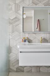 Bath, Wall Mount, Cork, Enclosed, Marble, and Ceiling The bathroom’s hexagonal marble tiles are by Ann Sacks, and the fixture, mirror, and wall cabinet are all by Duravit.
-
Chicago, Illinois
Dwell Magazine : September / October 2017  Bath Cork Marble Photos from An Interior Designer Helps His Mother Turn Her 1960s Chicago Apartment Into a Colorful Haven