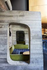 The first-floor auditorium/recording studio is located in a curvaceous wood pod that hovers above the bar in the basement. Concrete structural buttresses support the wall and act as stylized booth dividers.
-
New Haven, Connecticut
Dwell Magazine : September / October 2017