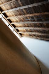 A giant plywood scoop curves down from a row of clerestory windows in the loft, refracting light.
-
New Haven, Connecticut
Dwell Magazine : September / October 2017