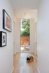 Hallway and Medium Hardwood Floor  Photo 9 of 14 in An Austin Couple Turn a Ranch Home Into a Refreshing Live/Work Space