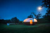 Exterior, Tiny Home Building Type, Small Home Building Type, House Building Type, Wood Siding Material, Curved RoofLine, and Dome RoofLine  Search “guide 7 not so tiny small house resources” from A Fantastic Egg-Shaped Camping Pod Along the Loire Estuary