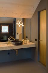 Bath Room, Wood Counter, Vessel Sink, and Wall Lighting  Photo 10 of 12 in A Peaceful Bavarian Retreat With Expansive Outdoor Terraces