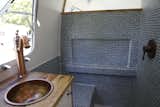 Bath Room, Mosaic Tile Wall, Wood Counter, and Drop In Sink  Photo 14 of 15 in Airstream Dream Team: These Women Travel the Country, Turning Retro RVs Into Homes