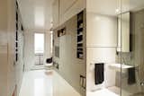 Bath Room, Wall Mount Sink, Concrete Wall, Recessed Lighting, Ceiling Lighting, and Enclosed Shower  Photos from A Tiny Apartment in Slovakia Makes Clever Use of Space