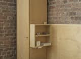Cantilevered shelves flank the bed and function as nightstands.

New York, New York
Dwell Magazine : November / December 2017  Photo 17 of 19 in This Compact Apartment in NYC Is Full of Crafty Solutions