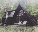 This newly renovated, modern A-frame is set on a private road in a wooded area in the heart of the Catskills. Its airy open floor plan features two full bedrooms, two private baths, and a chef's kitchen.