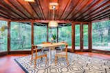 Dining Room, Pendant Lighting, Chair, Table, and Concrete Floor  Photo 8 of 11 in Live Out Frank Lloyd Wright’s Usonian Vision in This Home That’s Asking $725K