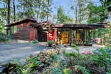 Exterior, Wood Siding Material, House Building Type, and Glass Siding Material  Photo 1 of 11 in Live Out Frank Lloyd Wright’s Usonian Vision in This Home That’s Asking $725K