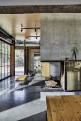 Living, Wood Burning, Concrete, Track, Table, Bench, Chair, and Corner High ceilings and clerestory windows fill the public rooms with light.
-
Tehachapi Mountains, California
Dwell Magazine : November / December 2017  Living Bench Corner Photos from At This High-Desert Home, a Whole Wall Opens Up When You Crank a Giant Wheel