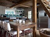 Kitchen, Refrigerator, Wood, Light Hardwood, Ceramic Tile, Ceiling, Wall, Range, Open, Rug, and Vessel  Kitchen Ceramic Tile Vessel Ceiling Open Photos from Rent One of These Cozy Cabins For a Ski Trip This Winter