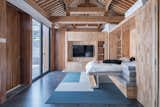 Bedroom, Bed, Rug, Shelves, Ceiling, and Track  Bedroom Ceiling Shelves Track Rug Photos from A Smart TV Controls the Layout of This Futuristic Beijing Home