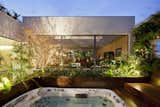 Outdoor, Hot Tub, Wood, Raised Planters, and Landscape  Outdoor Hot Tub Landscape Photos from Living Green Walls Bring Jungle Vibes Into a Brazilian Apartment